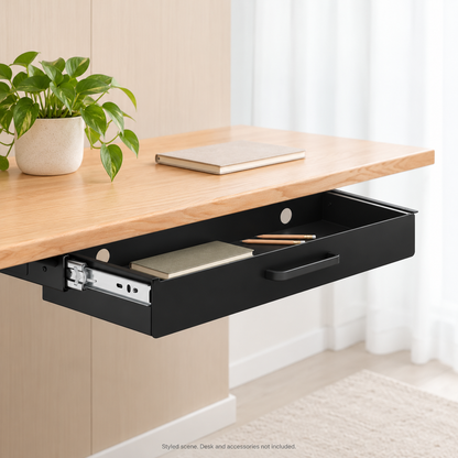 Styled home-office scene with the black drawer mounted beneath a wood desk, holding a notebook and pencils. Desk and accessories not included.